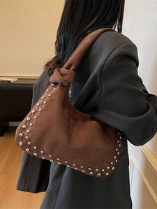 Brown suede underarm shoulder bag with silver studs and knotted strap detail