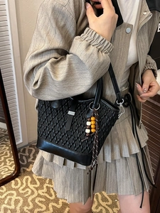 Elegant black woven leather tote bag for women with ethnic style decorative beads