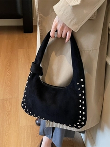 Large black suede shoulder bag with silver metal studs and knot detail strap