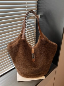 Large dark brown plush tote bag with faux fur texture and silver metal clasp for winter