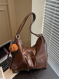 Brown vintage faux leather tote bag with adjustable strap and cute bear charm pendant