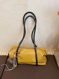 Minimalist large ginger yellow Boston shoulder bag with textured leather and dual handles