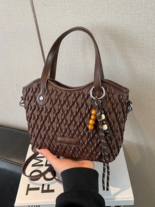 Retro coffee brown woven bucket bag with stylish wooden bead charm and long strap
