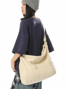 Sac bandoulière minimaliste en toile blanc cassé avec grande capacité et sangle réglable