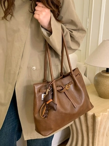 Brown leopard print tote bag for women featuring buckle strap and cute bear pendant charm