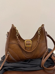 Vintage brown crescent shoulder bag with metallic chain handle and adjustable strap