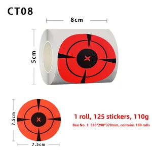 Macro detail of 7.5cm splatter target stickers roll with fluorescent red bullseye mark