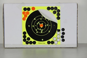 Detail view of 8-inch adhesive shooting target sticker showing green splatter impact holes
