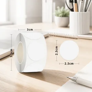 Detail of 2.5cm round white adhesive labels in roll format with 500 pieces per roll