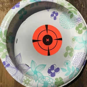 Adhesive splatter target stickers for archery and shooting practice with orange crosshair