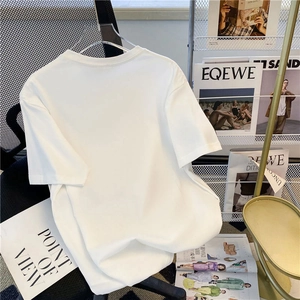 Detail of premium white cotton t-shirt fabric with smooth texture and round neckline