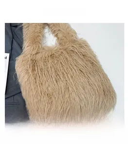 Detail shot of plush faux fur tote bag in warm camel brown with soft textured finish