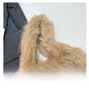 Detailed macro view of soft faux fur tote bag handle with high-quality stitching
