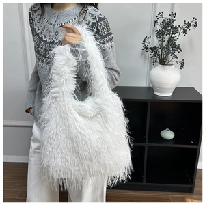 Detail of soft white feather Hobo bag with plush texture and spacious shoulder design