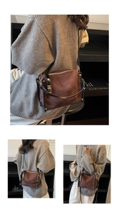 Detail of rhomboid quilted small crossbody bag in brown and black leather texture