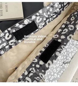 Detail of leopard print tote bag with secure Velcro closure and inner zipper pocket