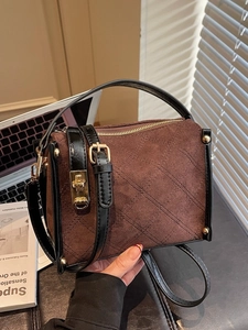 Vintage quilted suede handbag in dark brown with gold turn-lock and crossbody strap