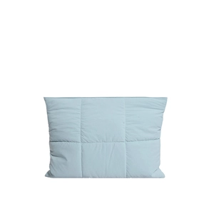 Minimalist light blue quilted laptop sleeve with magnetic closure and soft padded texture