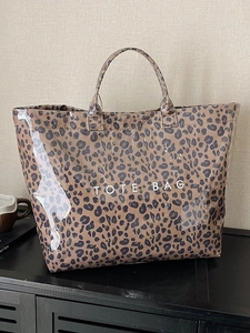 Large leopard print tote bag with transparent PVC coating and TOTE BAG text