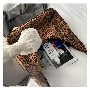 Detailed interior of the leopard print tote bag showing large capacity and daily items
