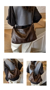Detailed view of dark brown vintage soft leather tote bag with vertical stitching