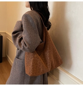 Detail of large leopard print tote bag in soft faux suede for versatile daily styling