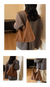 Macro detail of brown leopard print hobo tote showing matte suede texture and wide strap