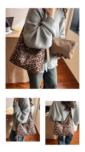 Detail of leopard print tote bag with a minimalist beige zipper storage pouch
