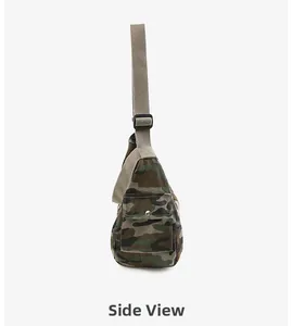 Side view of camouflage canvas crossbody bag featuring silver snap button pocket