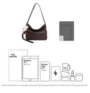 Detail showing the large capacity of this vintage tote bag, fitting an 11-inch iPad Pro