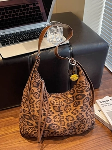 Vintage leopard print hobo bag with tassel and pompom, ideal for office commuting