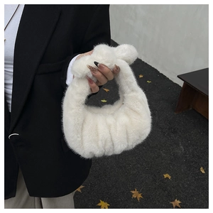 Detail of soft cream faux fur handbag with knotted handle and cloud-like pleats