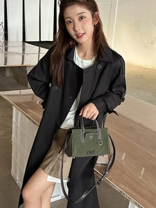 Retro forest green suede tote bag with brown leather handles and vintage bronze rings