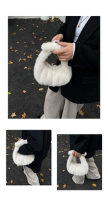 Detail view of the soft white faux fur texture on this trendy ruched cloud handbag