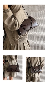 Detail view of dark brown vintage chain bag with adjustable strap on beige background