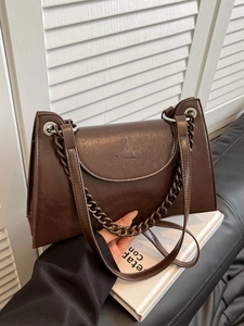 Retro dark brown crossbody bag with chain and leather strap in a stylish aesthetic