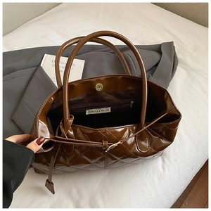 Brown quilted patent leather tote bag with glossy finish and magnetic closure