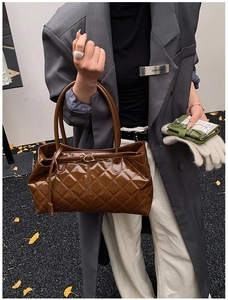 Fashionable dark brown patent leather tote bag with diamond quilted design and long handles