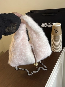 Pink plush triangle handbag with golden sphere charm and silver chain strap