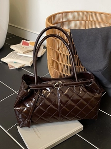 Chocolate brown patent leather tote bag with quilted diamond pattern and top handles