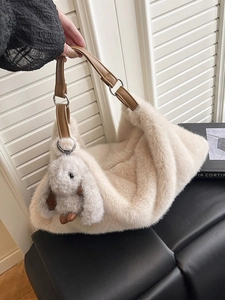 Chic off-white plush faux fur shoulder bag with brown leather strap and bunny charm