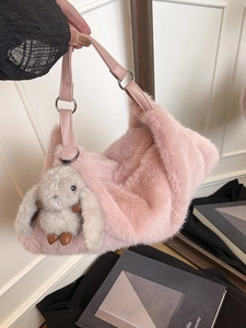 Pink faux fur tote bag with plush rabbit pendant and leather handle for women