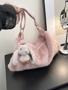 Pink faux fur shoulder bag with grey rabbit pendant and leather strap for women