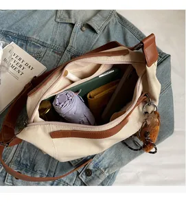 Interior view of off-white canvas tote bag showing large capacity for personal essentials