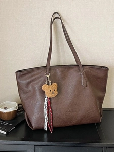 Large vintage brown faux leather tote bag with bear charm and long shoulder straps