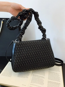 Minimalist black quilted shoulder bag with ruched strap and stylish diamond pattern