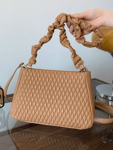 Chic tan rhombus quilted shoulder bag with unique ruched cloud strap and long crossbody strap