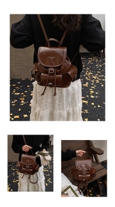 Detail view of brown vintage leather backpack with drawstring and flap closure