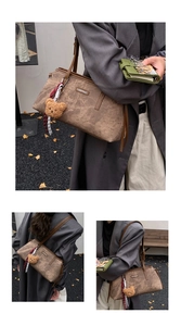 Close-up of retro brown tote bag with bear charm and vintage texture detail