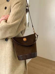 Retro coffee brown suede bucket bag with leather trim and gold fashion buckle